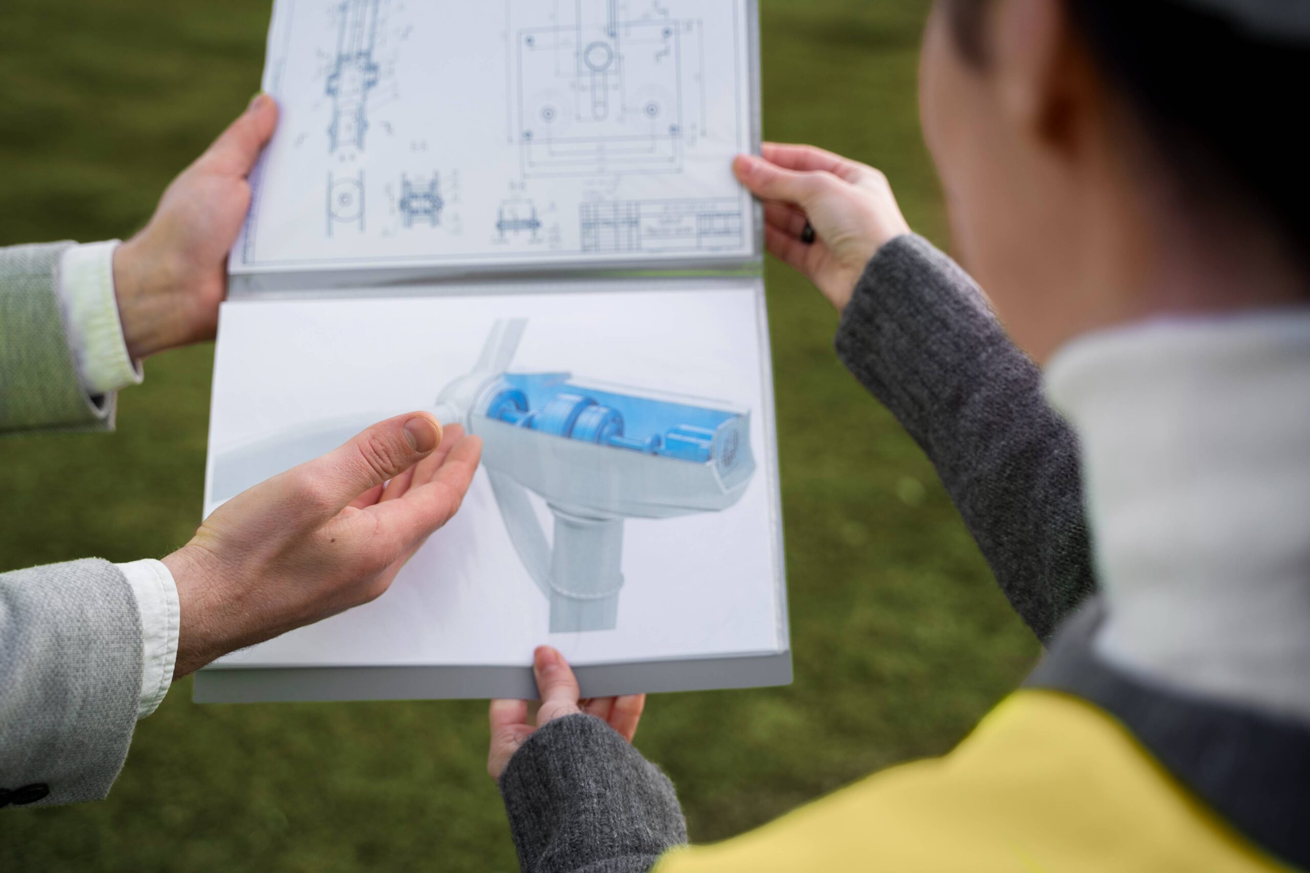 high-angle-engineers-discussing-environmental-plan (1)
